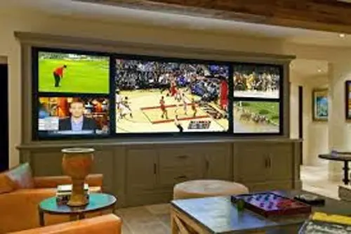 Tailored Audiovisual Setup: An image highlighting a custom installation of TVs, monitors, and projectors, designed to deliver a personalized and immersive audiovisual experience for optimal entertainment or professional use.